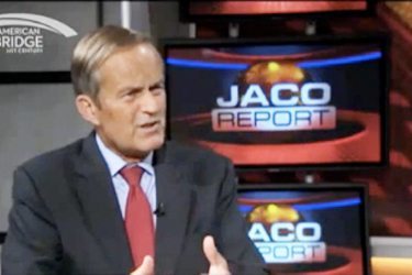 Todd Akin talking in front of Jaco Report logo