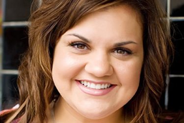 [Photo: Headshot of Abby Johnson, a white woman with Brown hair, smiling.]