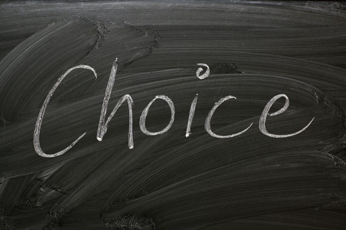 [The word 'Choice' handwritten in white chalk on a blackboard]