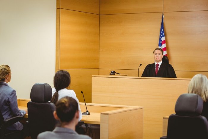 [Photo of a courtroom]