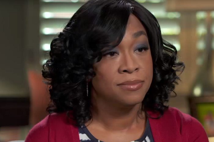 Close-up of Shonda Rhimes, in red sweater and blue eyeshadow