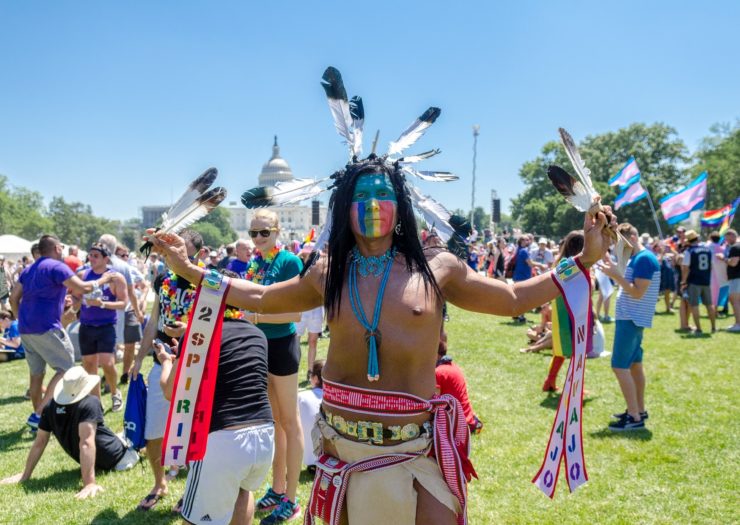 [photo: a Native American marcher stands on the National Mall during the equality march in Washington, DC, in June 2017]