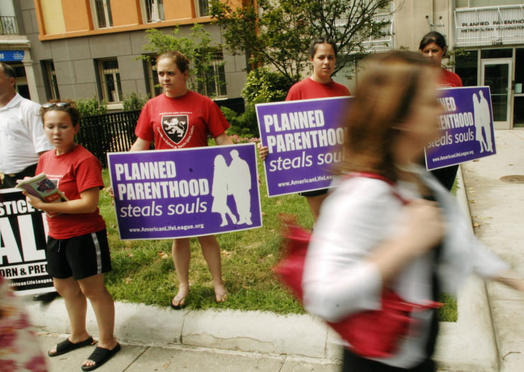 [Photo: Anti-abortion activists protest outside D.C. Planned Parenthood].