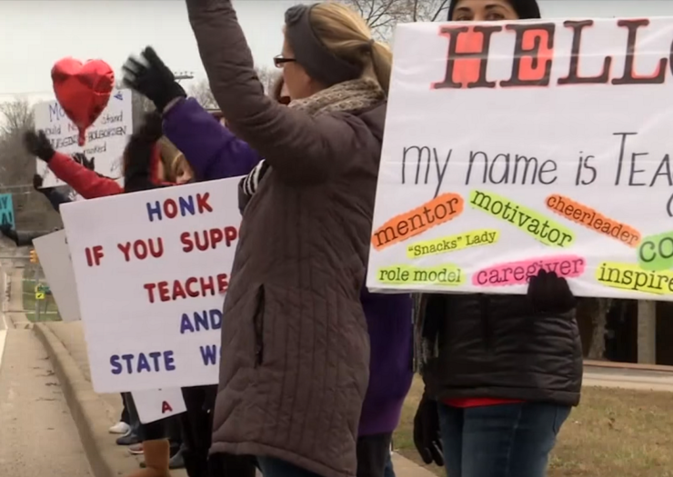 [Photo: Teachers strike in West Virginia.]