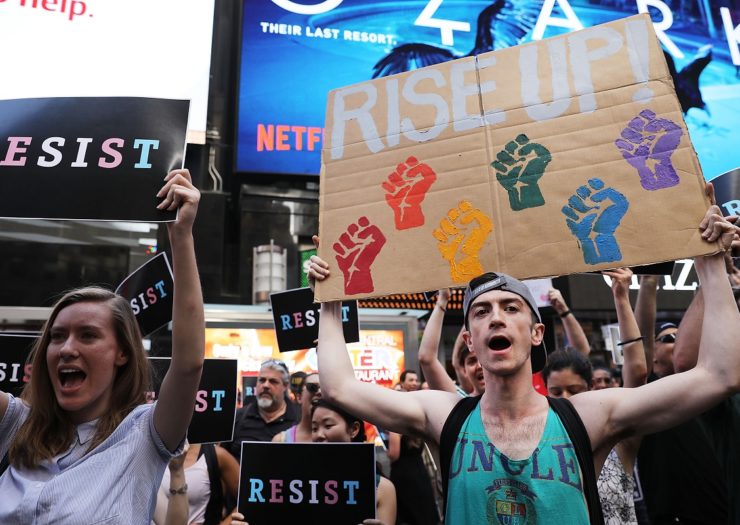 [Photo: Protesters rally to oppose LGBTQ discrimination]