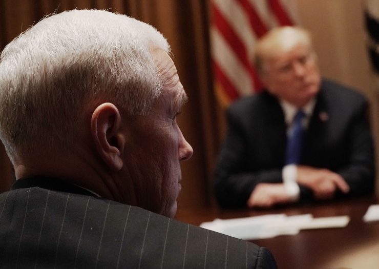 [Photo: U.S. President Donald Trump (R) and Vice President Mike Pence (L) listen during a meeting with bipartisan members of the Congress at the Cabinet Room of the White House.]