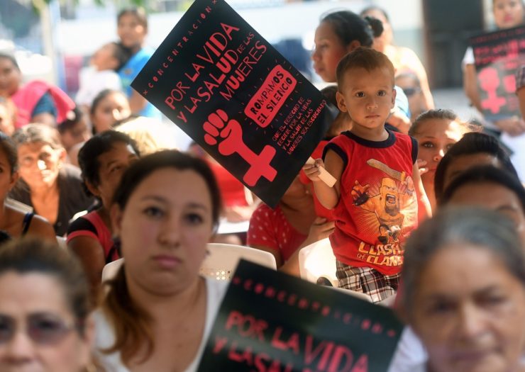 [Photo: Salvadoran women and children take part in a demonstration to demand the decriminalization of abortion]