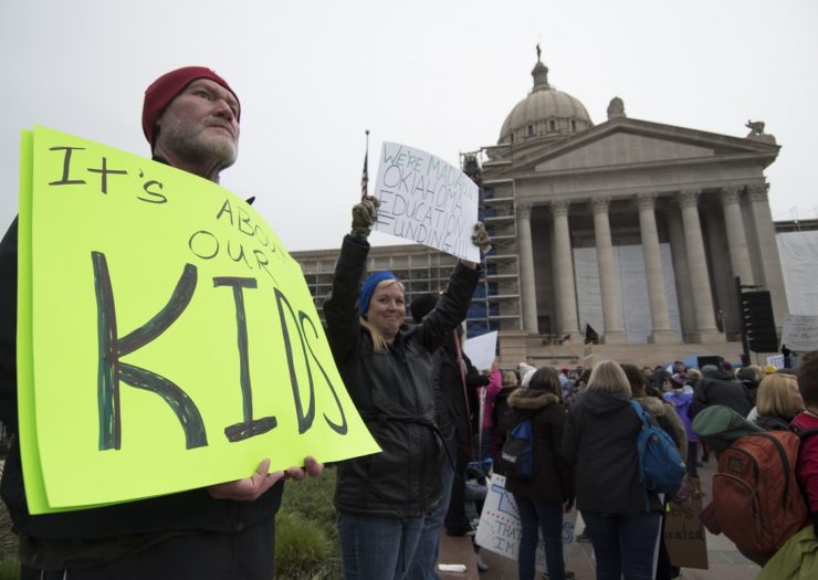 [Photo: Teachers rally outside of the Oklahoma state Capitol]