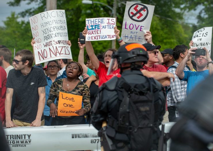 [Photo: Counter-protesters chant in opposition to members of the National Socialist Movement and other white nationalists who were rallying in Newnan, Georgia]