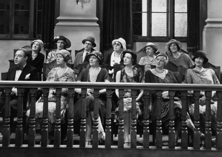[Photo: A Black and white photo of the jury dressed in clothes from the 1920's]