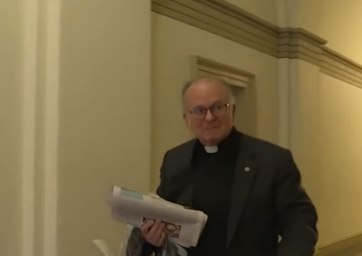 [Photo: Father Patrick Conroy, the House chaplain walked out of a meeting]