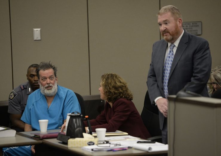 [Photo: Robert Lewis Dear sits with his attorneys in court]