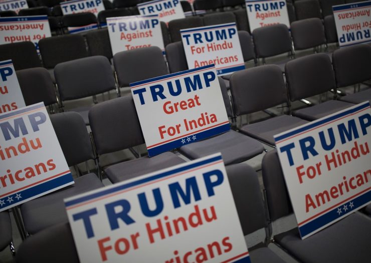 [Photo: Various Trump signs expressing Hindu support for Donald Trump are propped on multiple chairs]