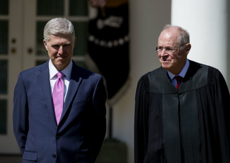 [Photo: Neil Gorsuch and Anthony Kennedy stand next to each other.]