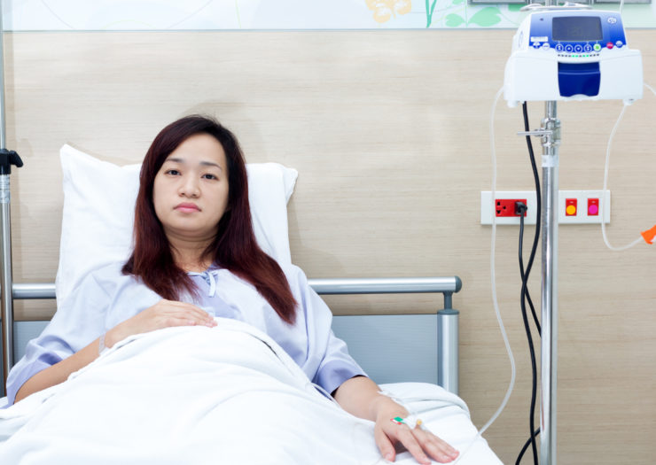 [Photo: Woman in Hospital]