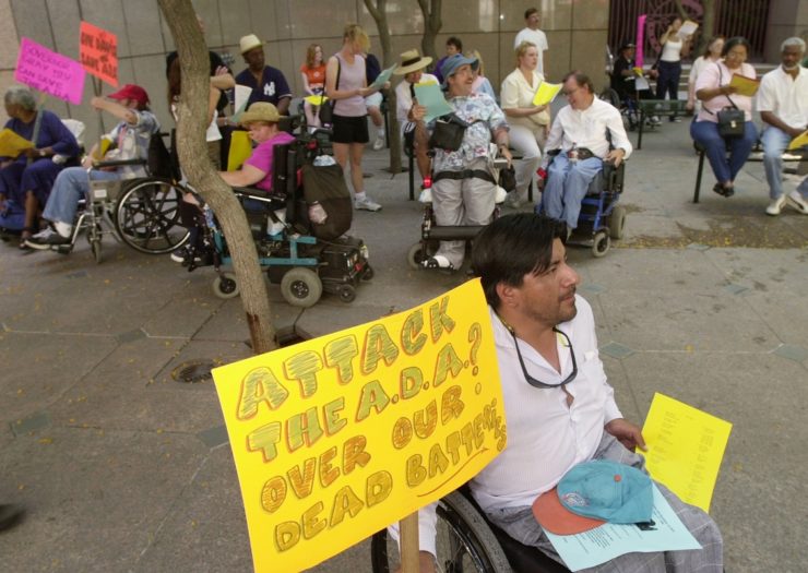 [Photo: Disabled demonstrators rally outside to support the Americans with Disabilities Act]