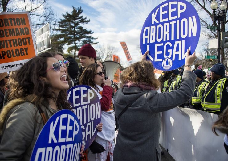 [Photo: Pro-Choice activists hold up signs that read 