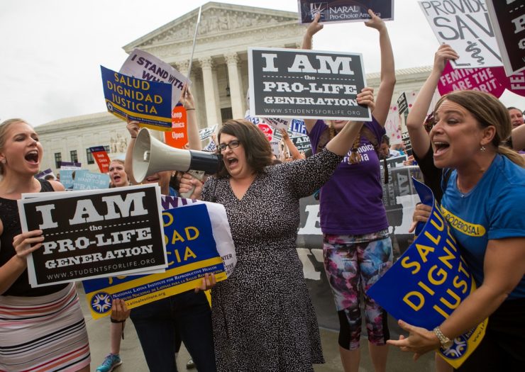 [Photo: Pro-Choice and Anti-Choice activists rally outside of the U.S. Supreme Court]