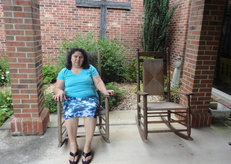[Photo: Juana Luz Tobar Ortega sits outside in a rocking chair]