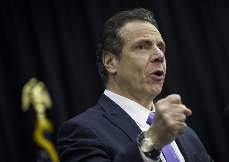 [Photo: Gov. Andrew Cuomo speaks at an event]