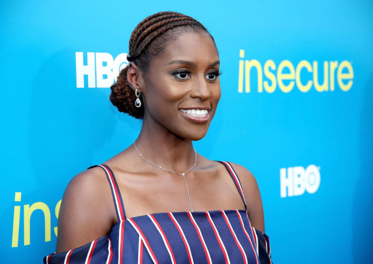 [Photo: Issa Rae in front of a sign that says 