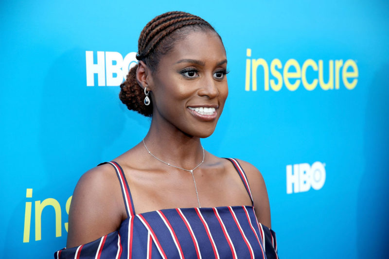 [Photo: Issa Rae in front of a sign that says