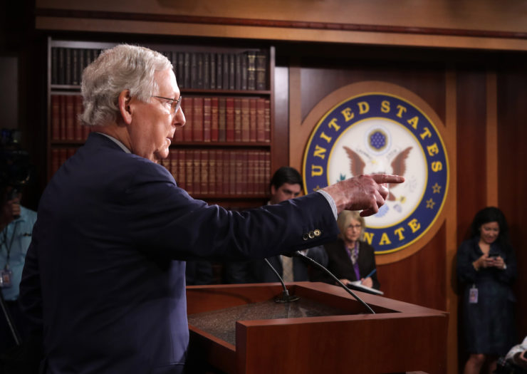 [Photo: Senate Majority Leader Mitch McConnell (R-KY) talks to reporters.]
