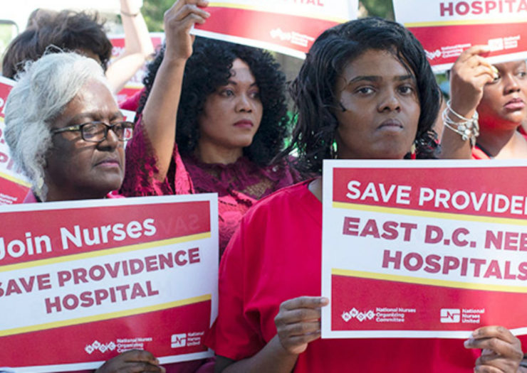 [Photo: A group of nurses protest Providence Hospital's closing]