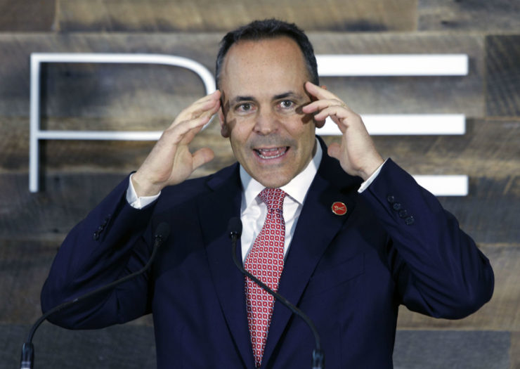 [Photo: Matt Bevin touches his head with both hands]