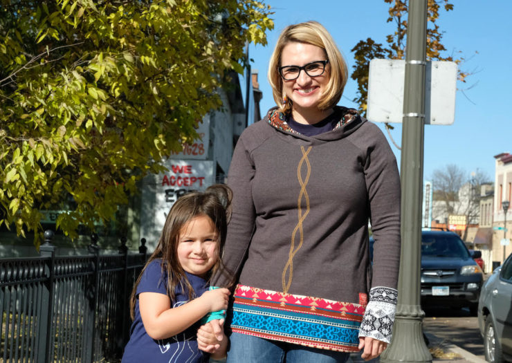 [photo: Peggy Flanagan stands with her daughter.]