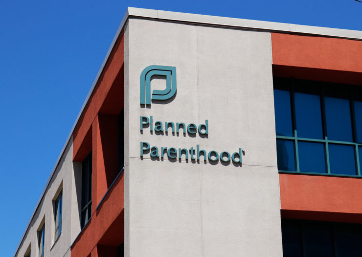 [Photo: Close up of a Planned Parenthood sign on a building.]