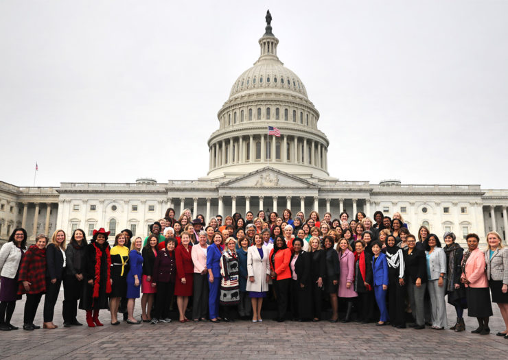 [Photo: House Democratic women pose with Speaker Nancy Pelosi in front of the U.S. Capitol.]