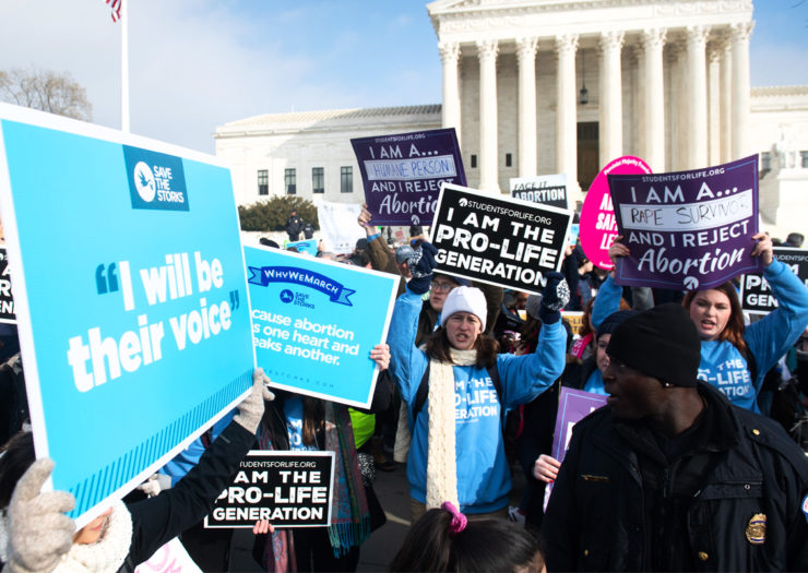 [Photo: Anti-abortion activists protest in front of the Supreme Court as part of the 'March for Life.']