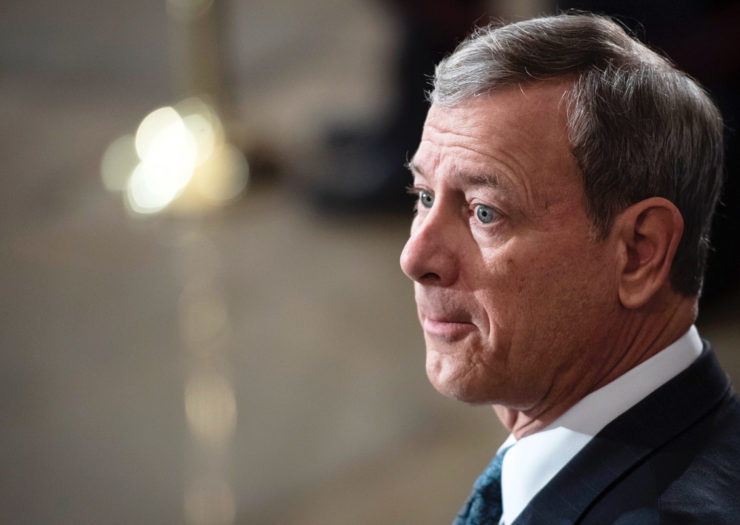 [Photo: Chief Justice John Roberts looks into the distance concernedly.]