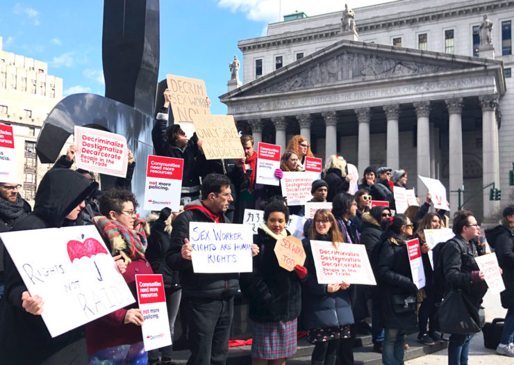 [Photo: Protestors holding various signs gather in front of New York County Supreme Court in favor of sex worker rights.