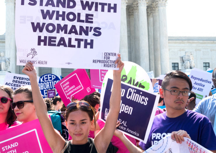 [Photo: Pro-choice protestors rally at the Supreme Court, waiting for the Whole Woman's Health decision to be announced.]