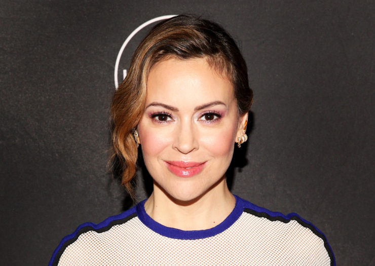 [Photo: Alyssa Milano smiles for a picture at an event.]