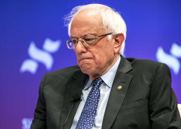 [Photo: Democratic presidential candidate Senator Bernie Sanders looks ashamed as he speaks to a crowd at the She The People Presidential Forum.]