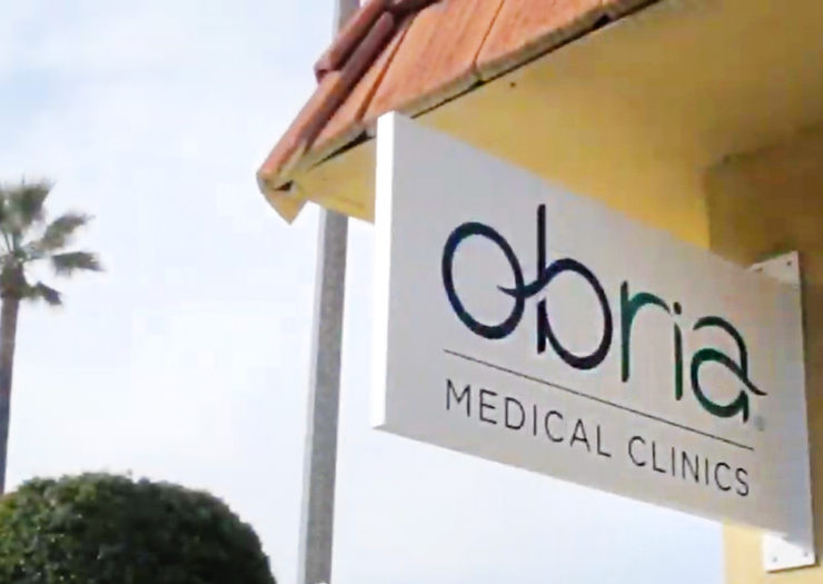 [Photo: An Obria Medical Clinics sign outside a clinic building.]