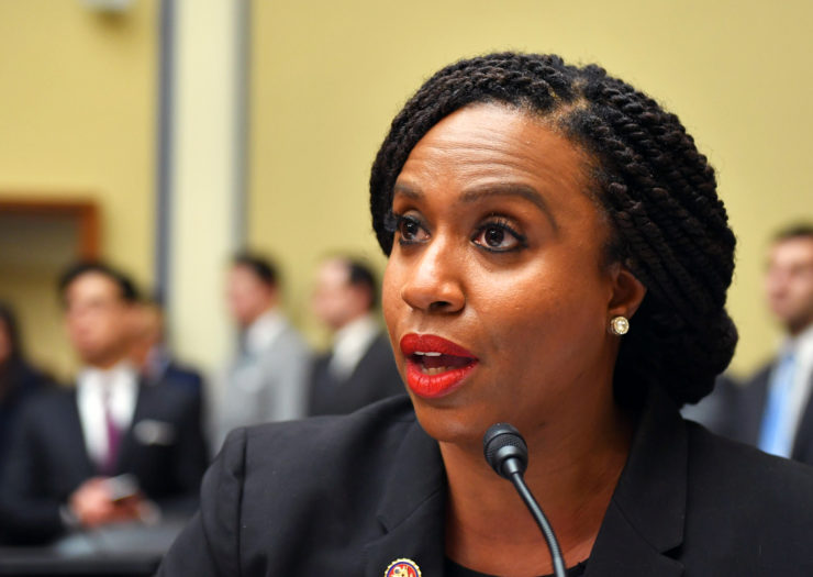 [Photo: Representative Pressley speaks during a committee hearing.]