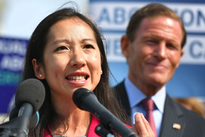 [Photo: Dr. Leana Wen speaks passionately during a press conference.]