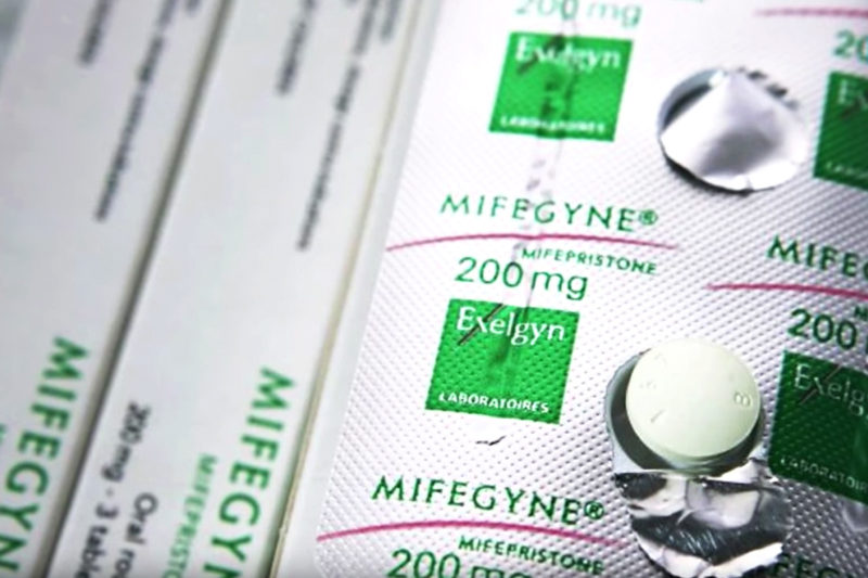 [Photo: A pill on a blister package of mifepristone.]