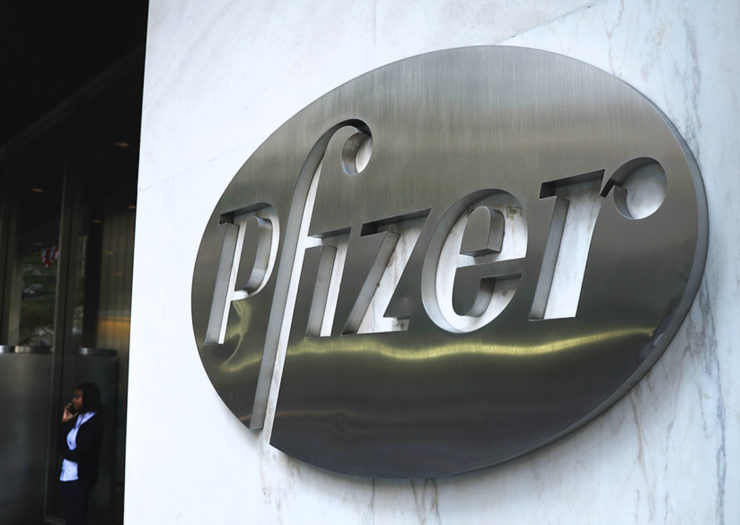 [Photo: The Pfizer logo at the Pfizer headquarters building.]
