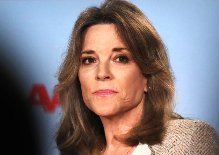 [Photo: Democratic presidential hopeful Marianne Williamson pauses during an event.]
