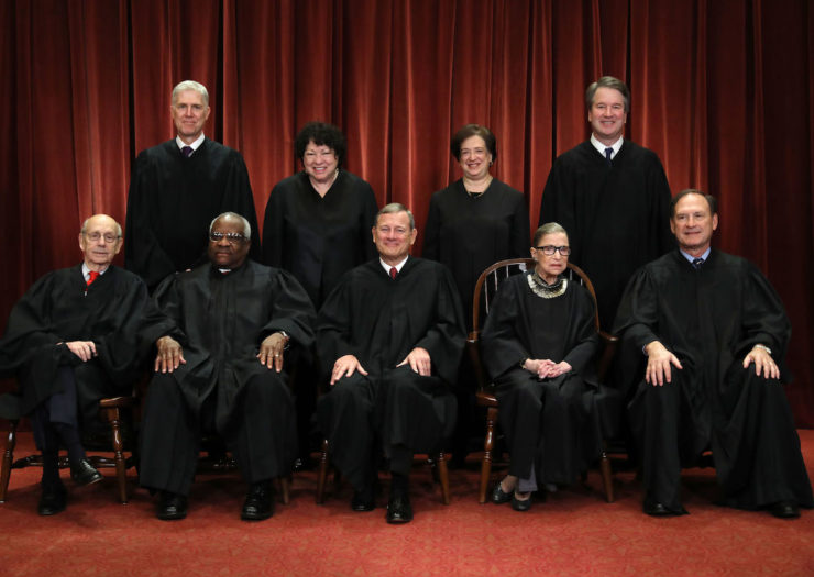 [Photo: U.S. Supreme Court justices in official group portrait]