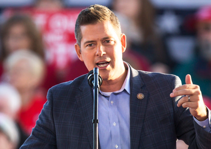 [Photo: U.S. Representative Sean Duffy gestures as he addresses a crowd during an event.]