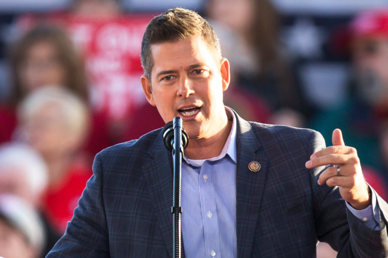 [Photo: U.S. Representative Sean Duffy gestures as he addresses a crowd during an event.]