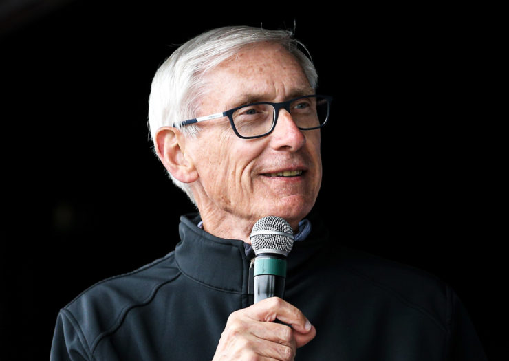 [Photo: Wisconsin Governor Tony Evers speaks at an event.]