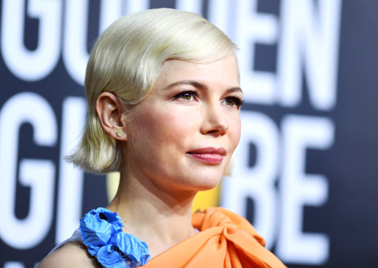 [Photo: Actress Michelle Williams poses for a photo on the red carpet.]