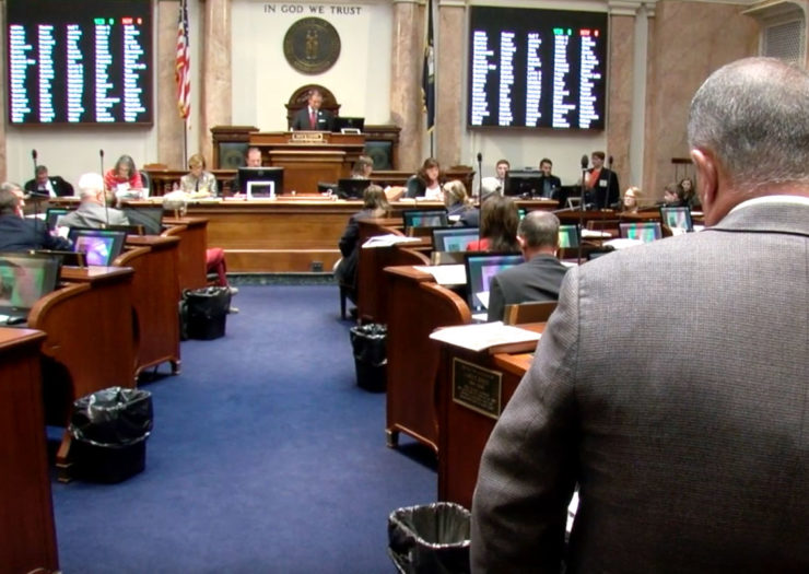 [Photo: Kentucky legislators gather for a legislative sessions.]